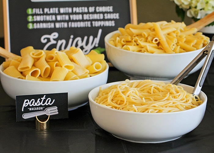 Host a fun and delicious dinner party at home with this easy Italian pasta bar! Mix and match pasta, sauce, and toppings to build the perfect bowl of pasta! 