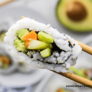 1 california roll in chopsticks