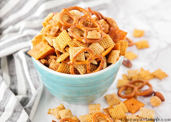 a bowl of homemade original chex mix is simple super bowl snack that everyone will love