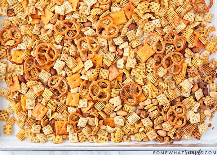 a baking sheet full of homemade original chex mix made in the microwave from this easy recipe