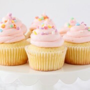 white cupcakes with pink frosting