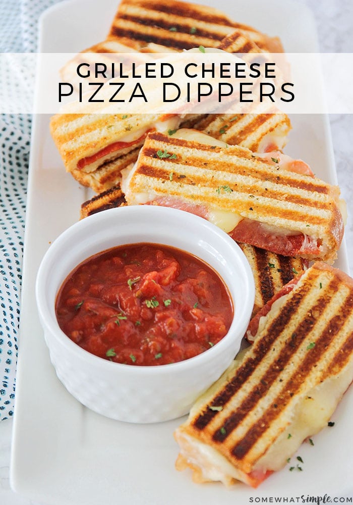 Pizza dippers will kick your grilled cheese sandwich game up a notch! Filled with mozzarella cheese, pepperoni or any of your other favorite pizza toppings, these dippers are easy to assemble.  When you take these pizza grilled cheese sandwiches and dip them into warm marinara sauce, they are bound to become a family-favorite!! #grilledcheesepizzadippers #pizzadippers #pizzadippersrecipe #pizzagrilledcheesesandwich #grilledcheesedippers via @somewhatsimple