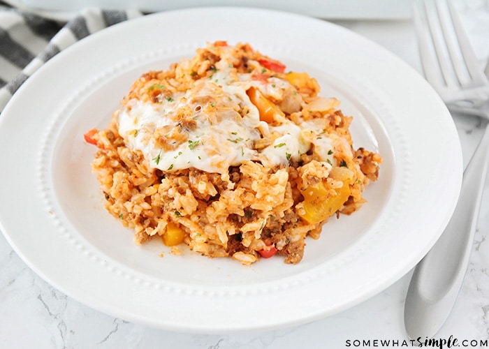 stuffed pepper casserole on a white plate with a fork next to the plate