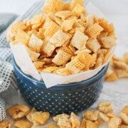 sweet Chex mix recipe in a dark blue bowl