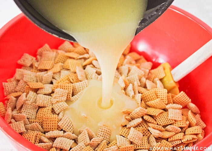 pouring the butter and sugar mixture over chex cereal is a step in making sweet chex mix