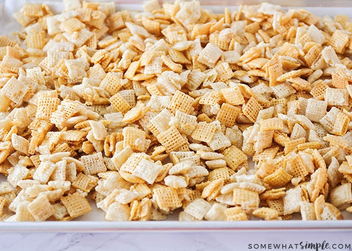 a cookie sheet full of sweet Chex mix made from this recipe