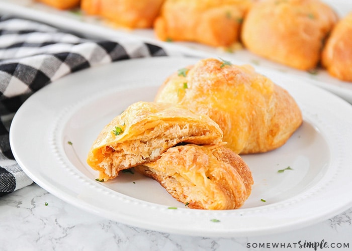 These delicious and savory chicken enchilada puffs are the perfect easy meal! They're stuffed with a cheesy chicken enchilada filling, and taste amazing!