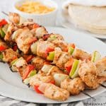 grilled chicken skewers with bell peppers and onions