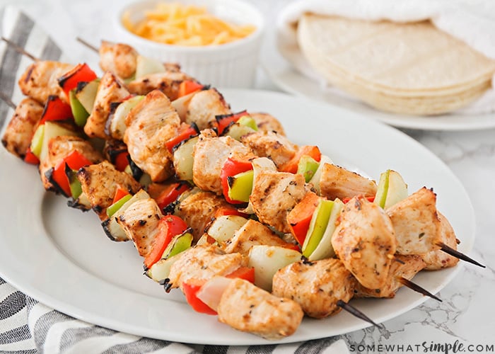 a stack of chicken fajitas on a plate are an easy super bowl snack