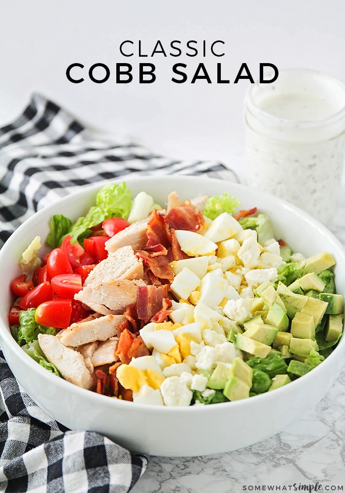 This classic Cobb salad is so fresh and delicious, and is the perfect summer meal! It's loaded with chicken, bacon, avocado, eggs and more, easy to make and tastes incredible! Top it with the a homemade ranch dressing and it won't get any better than this! #cobbsalad #homemadedressing #cobbsaladrecipe #bestcobbsalad #howtomakeacobbsalad via @somewhatsimple