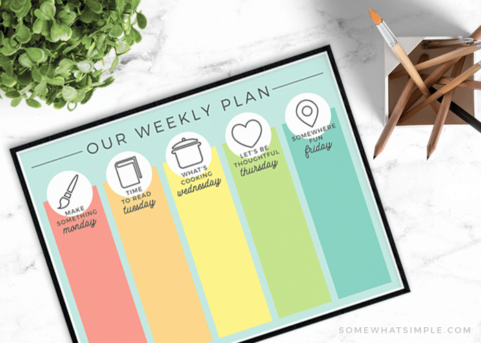 looking down on a multi-colored daily summer schedule free printable template