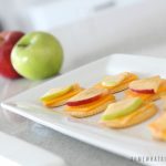 a tray with Apple Cracker and cheese snacks Snacks