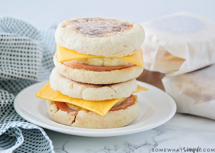 a stack of breakfast sandwiches on English muffins