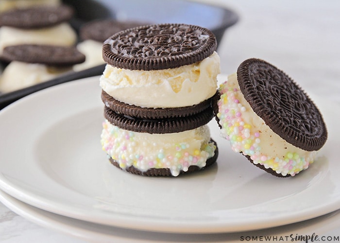 3 mini Oreo ice cream sandwiches in a stack on a white plate