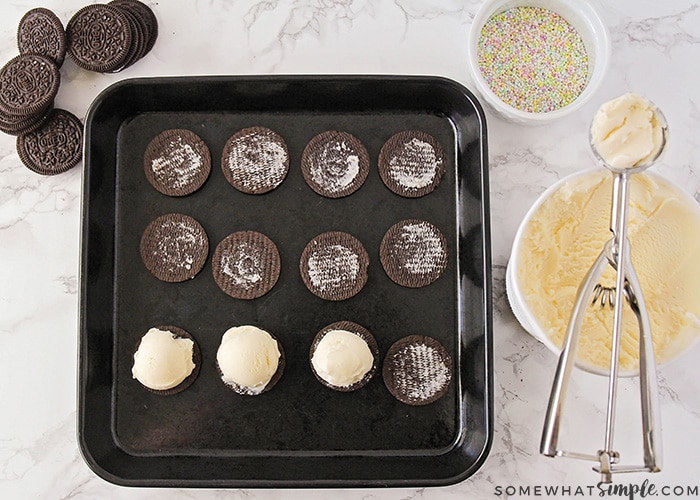 Oreos, ice cream and sprinkles on a counter. Building ice cream sandwiches