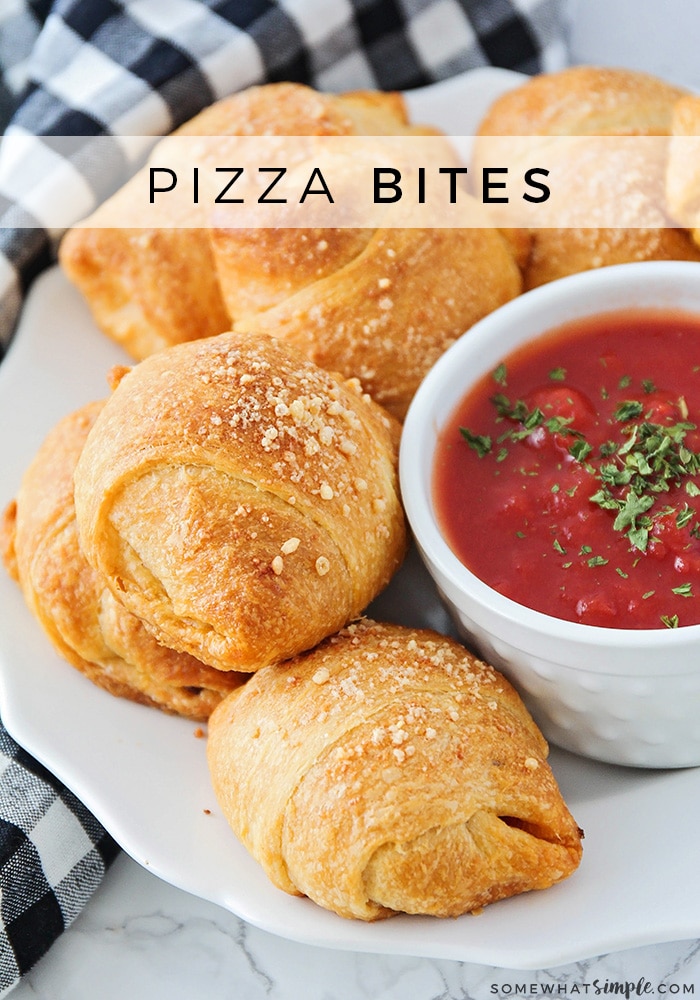 These mini homemade pizza bites are a simple meal or snack that can feed a small family or a large crowd!  Filled with cheese, pepperoni or any of your other favorite pizza toppings, this easy recipe will make everyone happy.  #pizza #pizzabites #howtomakehomemadepizzabites #minipizzabites #homemadepizzabites via @somewhatsimple