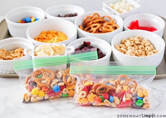 several bowls filled with ingredients to make your own trail mix