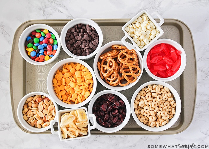 a tray with several salty and sweet trail mix ingredients you can include in your own homemade trail mix recipe 