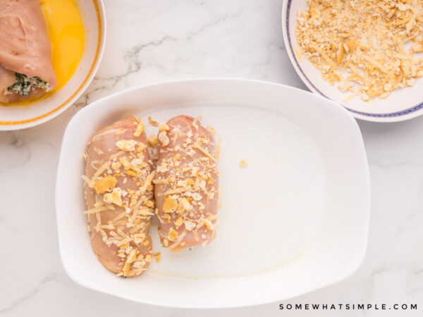 raw chicken dipped in ritz crackers before baking