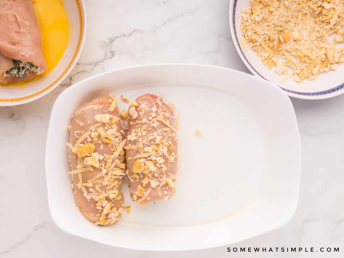 raw chicken dipped in ritz crackers before baking