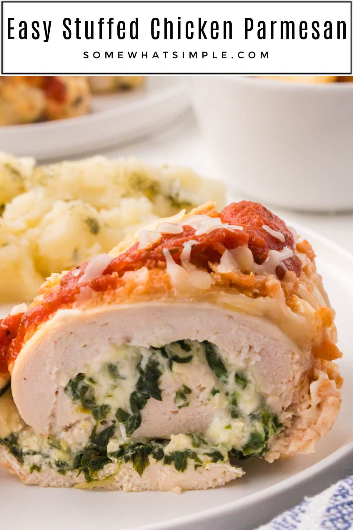 Stuffed Chicken Parmesan is a delicious twist on a favorite dinner recipe. Tender chicken filled with cheese and topped with a simple crust - it'll quickly become one of your favorite ways to make chicken for the family! via @somewhatsimple