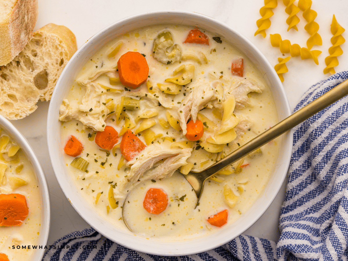 Finished Crockpot Creamy Chicken Noodle Soup in a white bowl.