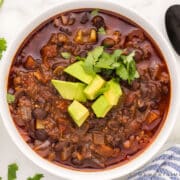 finished chorizo soup in a white bowl