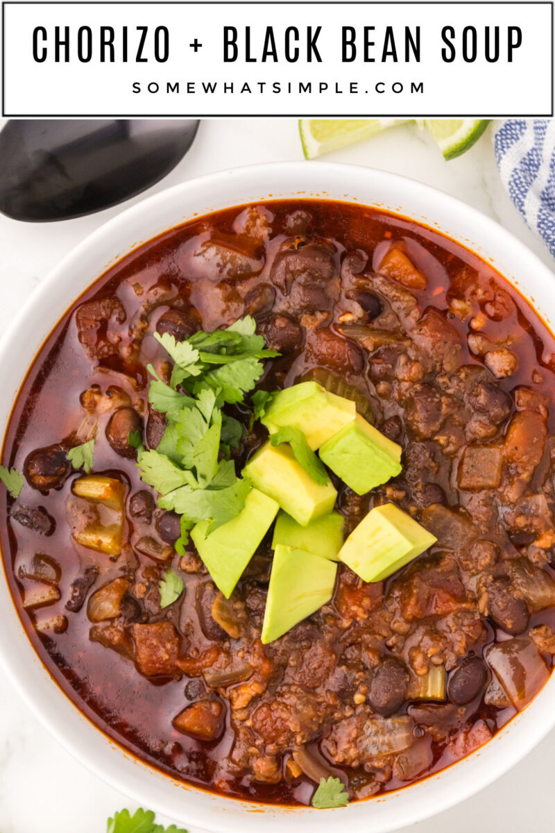 long image of chorizo soup in a white bowl