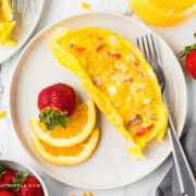 plated Omelets in a Bag with sliced fruit