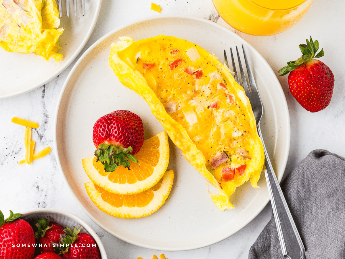 plated Omelets in a Bag with sliced fruit