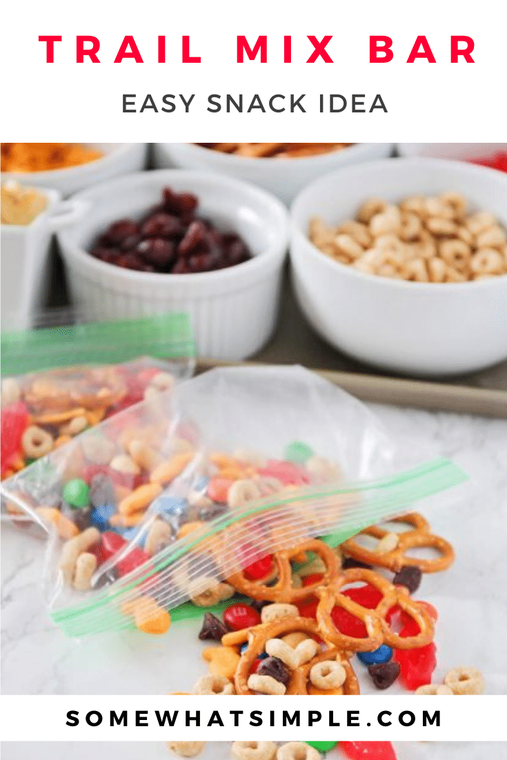 This make your own trail mix bar is such a fun way to get the kids involved. Lay out a variety of trail mix ingredients, and let them assemble their own trail mix snack! It's easy to do and everyone is happy! #trailmix #trailmixrecipe #trailmixbar #kidstrailmix #funtrailmix #easysnackidea via @somewhatsimple