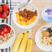 Yogurt parfaits set up on a table next to supplies