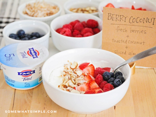 close up of a strawberries and coconut yogurt parfait