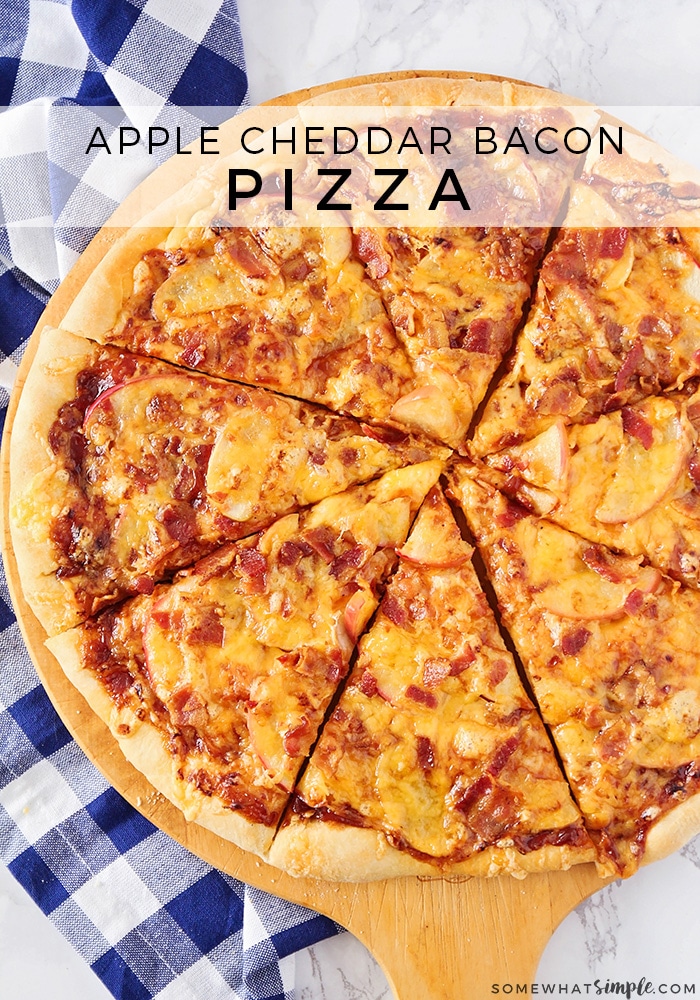 Kick up your homemade pizza game with this delicious apple cheddar bacon pizza.  Made with thin slices of apple and smoked bacon, your taste buds are about to fall in LOVE! #applecheddarbaconpizza #easycheddarbaconpizzarecipe #cheesybaconpizza #applebaconpizzarecipe #howtomakecheddarbaconpizza via @somewhatsimple