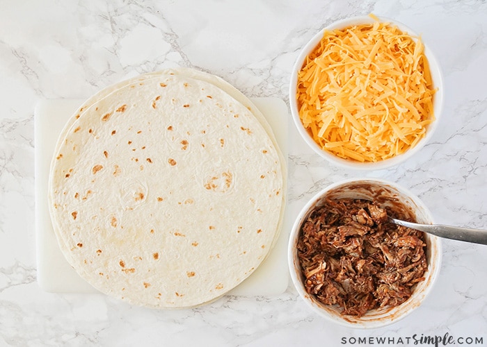 flour tortillas, shredded cheese and shredded bbq pork