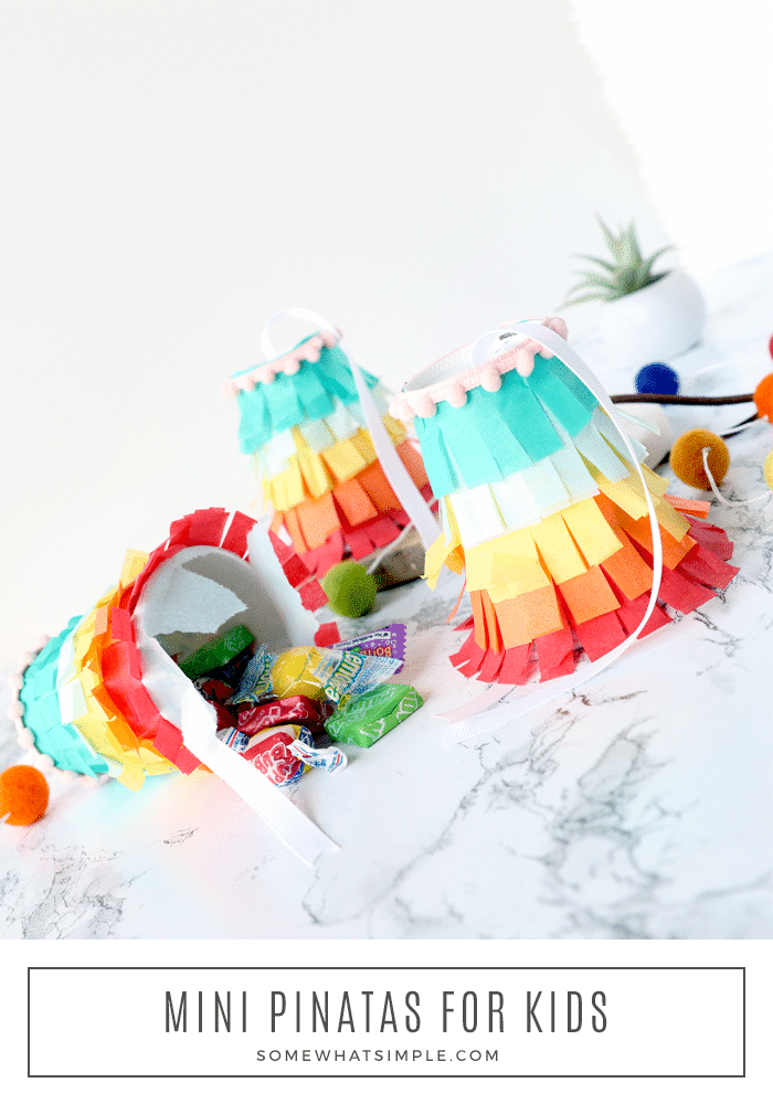 These homemade mini piñatas are an easy craft to make with your kids that are just as much fun to break open as the bigger ones.  Made using a few simple materials that are easy to find, these DIY piñatas are perfect for any celebration! via @somewhatsimple