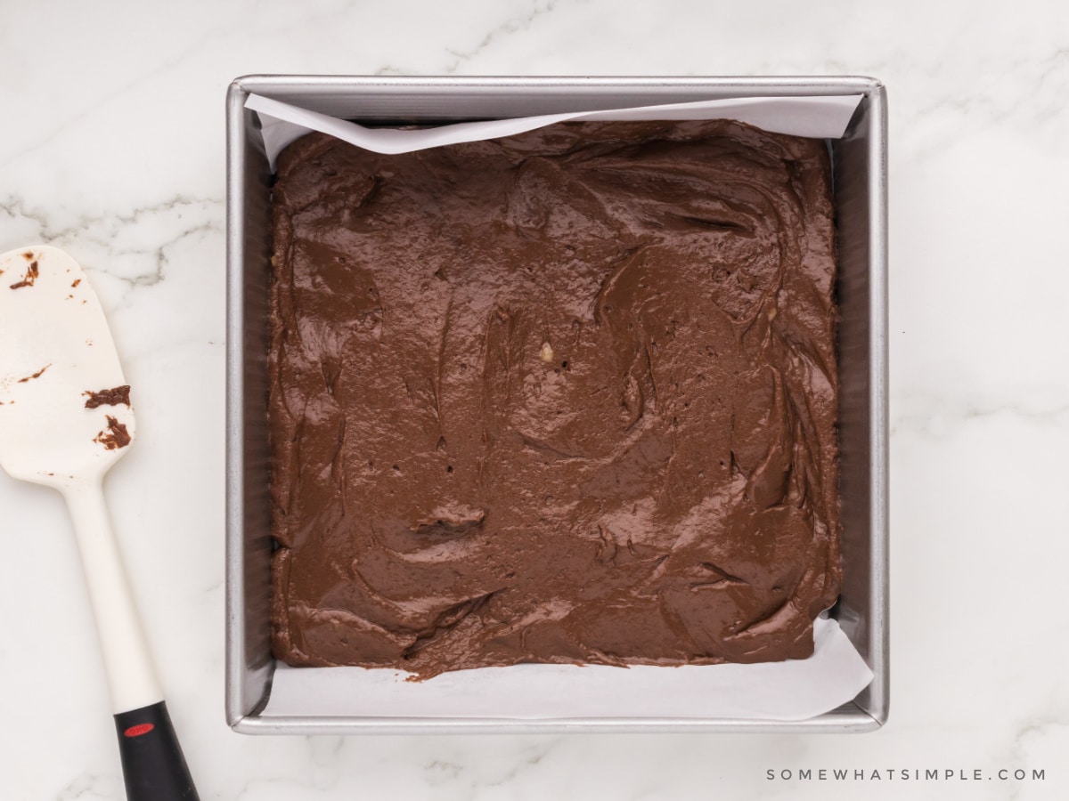 protein brownie batter in an 8x8 baking dish