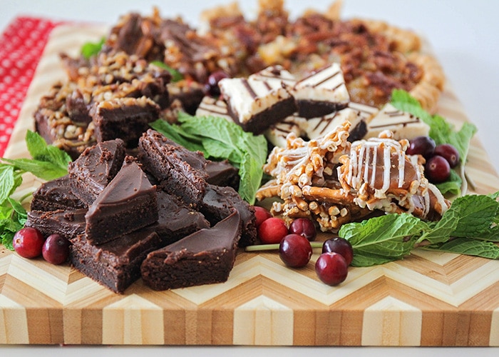 a holiday dessert tray filled with different treats