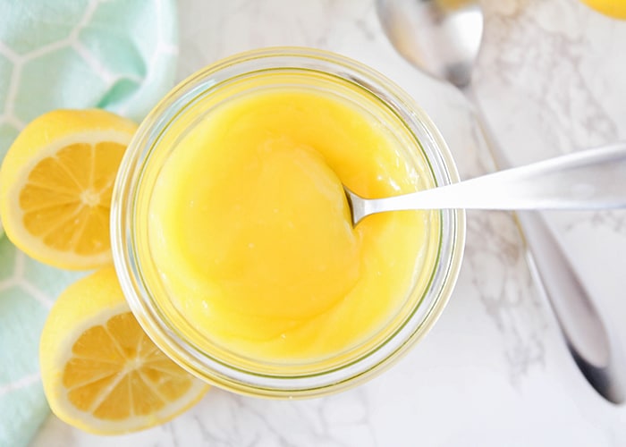 This homemade lemon curd is a delicious mixture of tart and sweet! It's perfect on waffles, pancakes, and ice cream, and adds a sweet burst of lemon flavor!