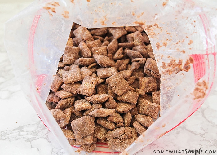 Muddy Buddies in a plastic ziploc bag that has been shaken up