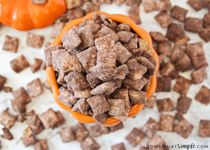 looking down on a bowl of pumpkin Chex Mix Muddy Buddies