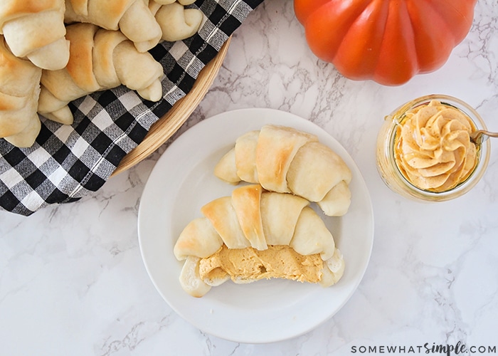 looking down on dinner rolls topped with Honey Butter made with Pumpkin