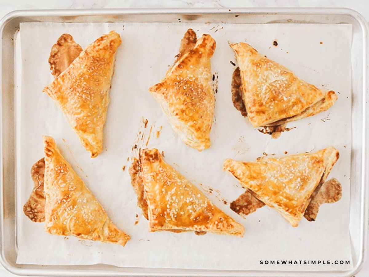 Apple Turnovers baked fresh from the oven on a baking sheet
