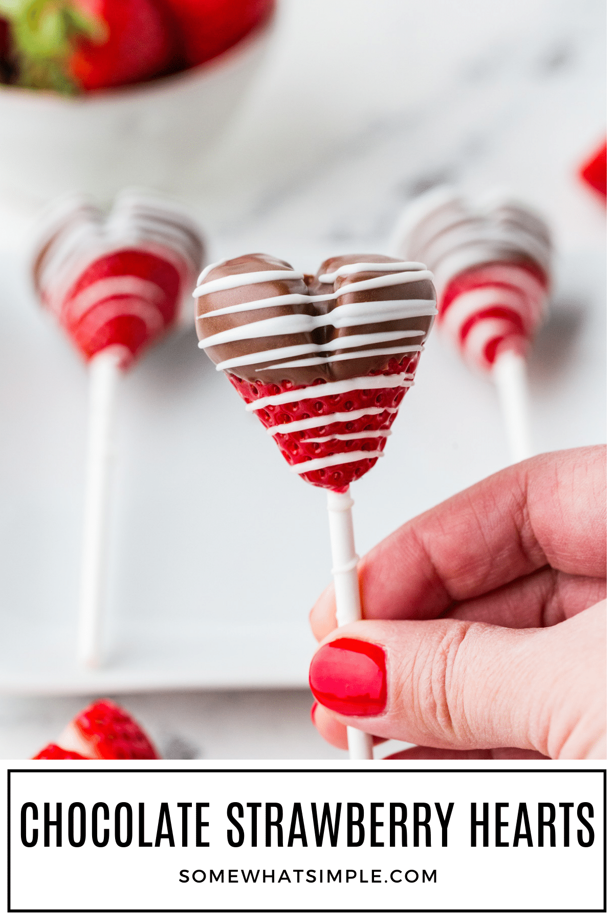 Valentine’s Day is the perfect time to show a little extra love with these simple homemade Chocolate-Covered Strawberry Heart Pops! via @somewhatsimple