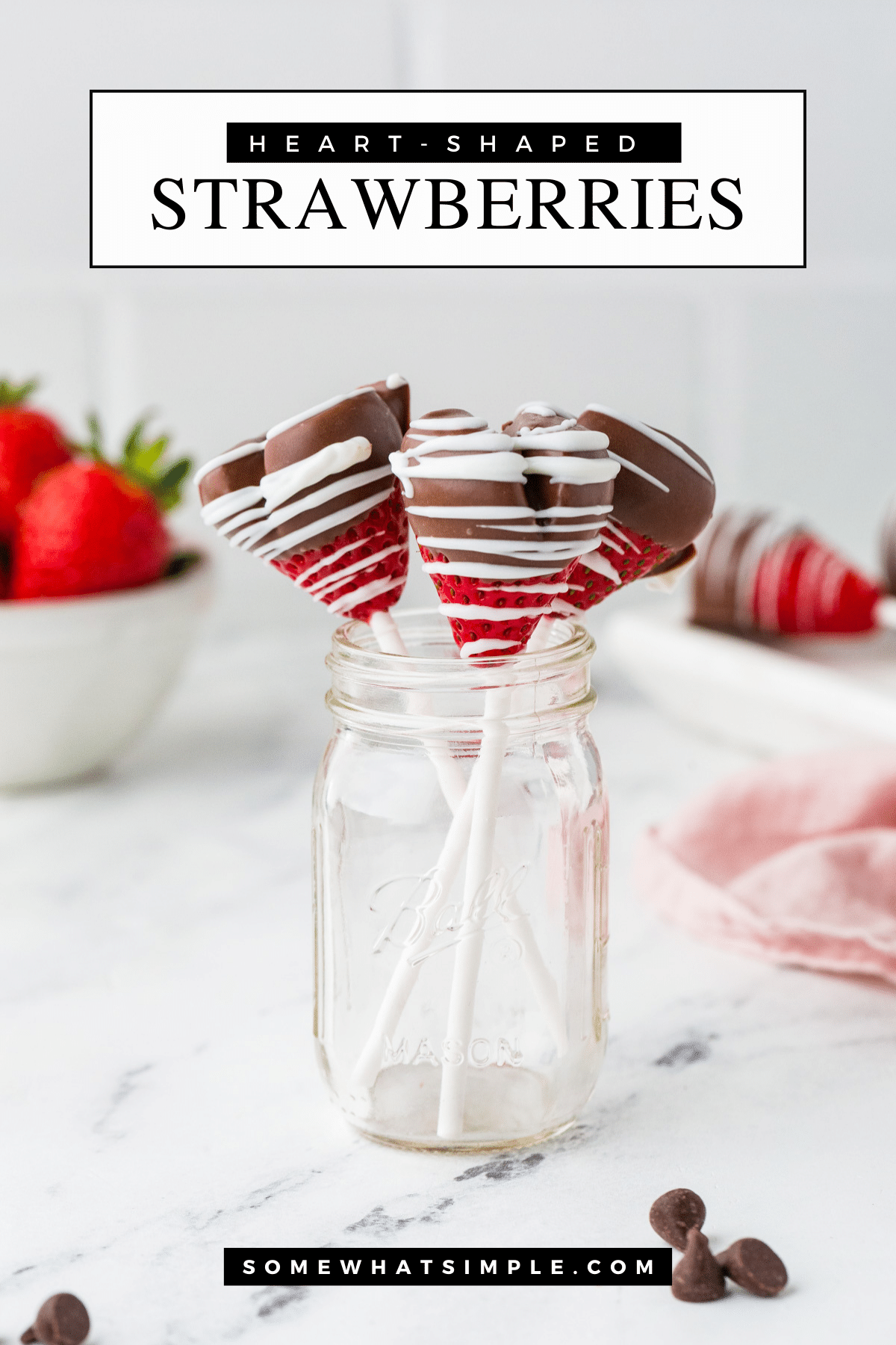 Valentine’s Day is the perfect time to show a little extra love with these simple homemade Chocolate-Covered Strawberry Heart Pops! via @somewhatsimple
