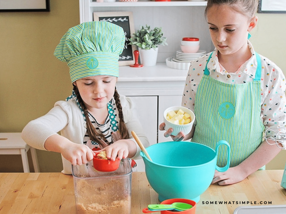 2 girls baking holiday cookies