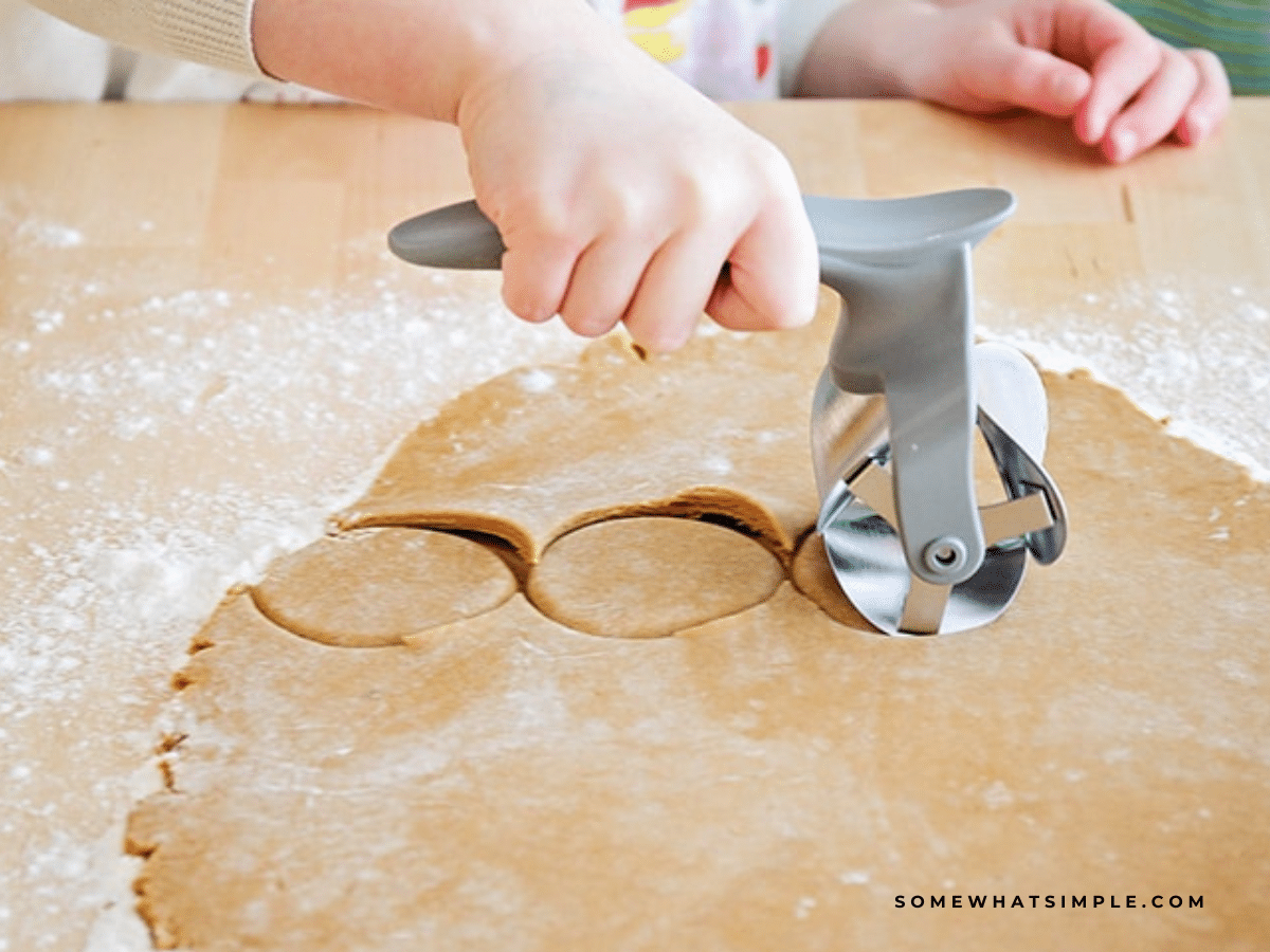 cutting out gingerbread dough