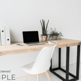 image of an office desk with a logo in the corner