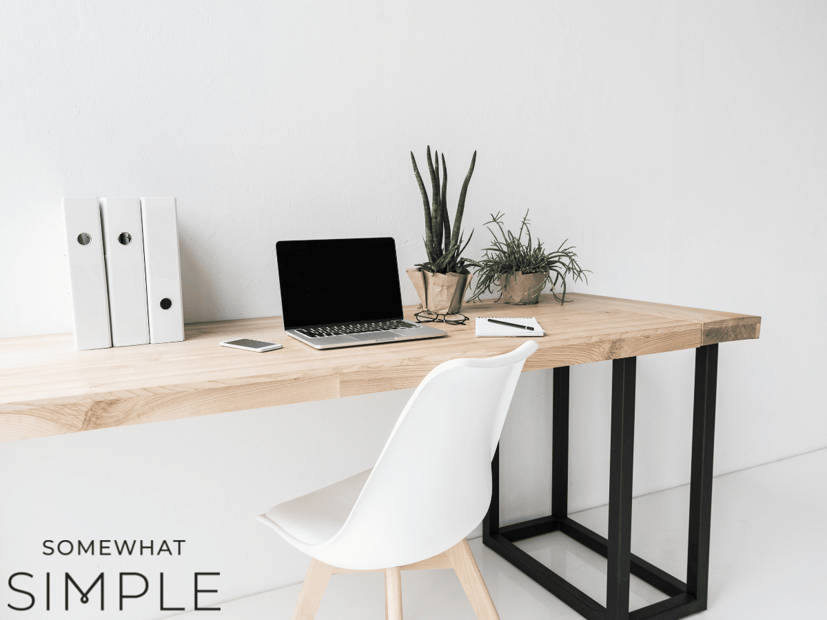 image of an office desk with a logo in the corner