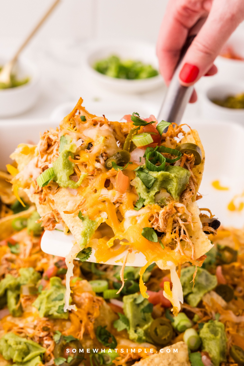 spooning a heaping pile of Loaded Nachos